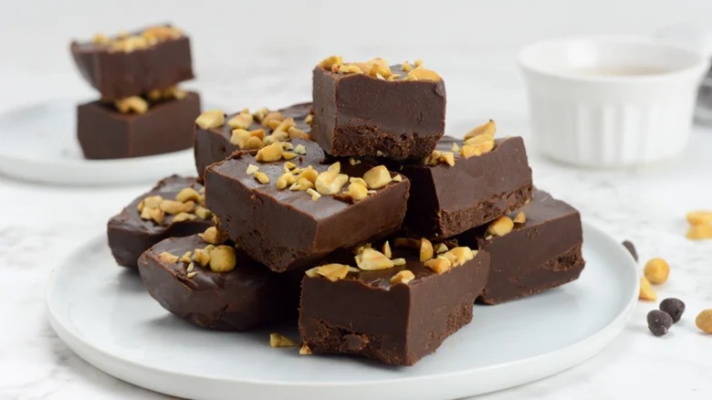 Keto chocolate peanut butter fudge stacked on a plate