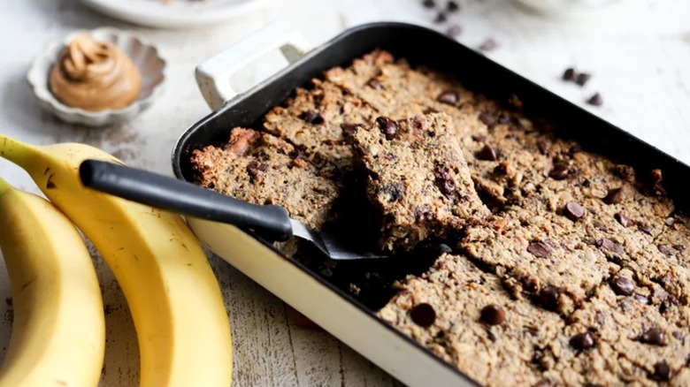 Peanut butter and roasted banana baked oatmeal in a casserole dish