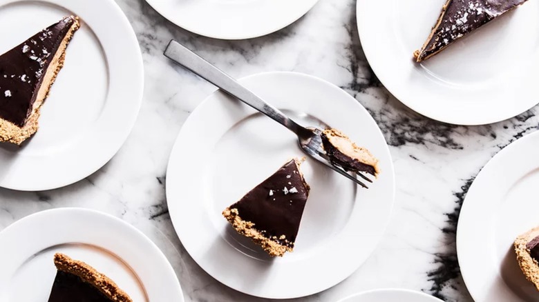 Slices of Tagalongs-inspired peanut butter chocolate pie on plates