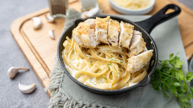 chicken pieces on fettucine alfredo