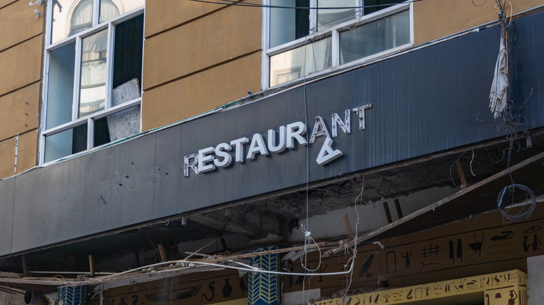 Broken restaurant sign