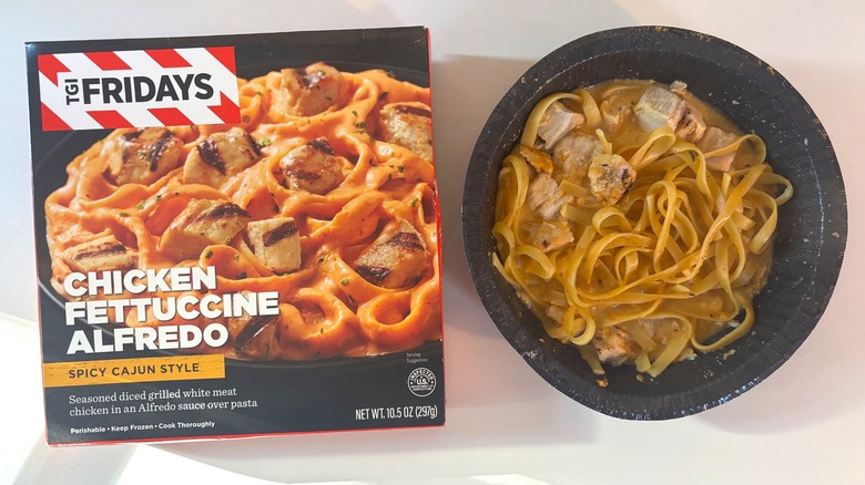 TGI Fridays frozen spicy cajun chicken alfredo bowl next to box on white table