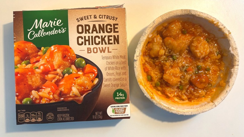 Marie Callender's frozen sweet & citrusy orange chicken bowl next to box on white table