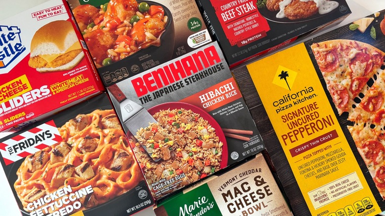 Several chain restaurant frozen meals next to each other on table