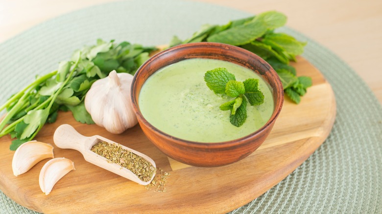 Creamy green sauce on board