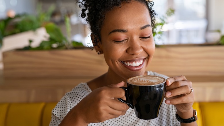 Woman holding coffee