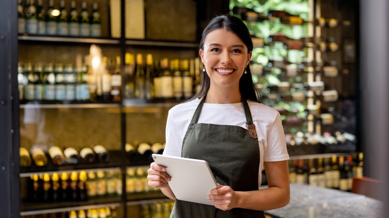 Server smiling at customers