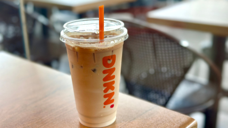 a dunkin' iced coffee beverage on a table