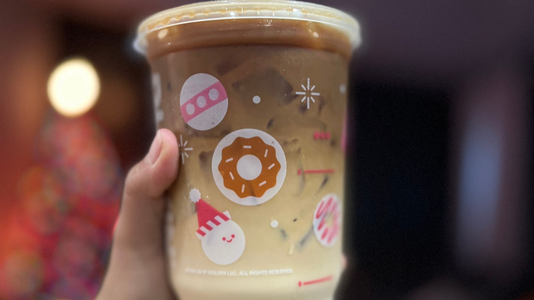 a close-up of a seasonal cup of dunkin' iced coffee