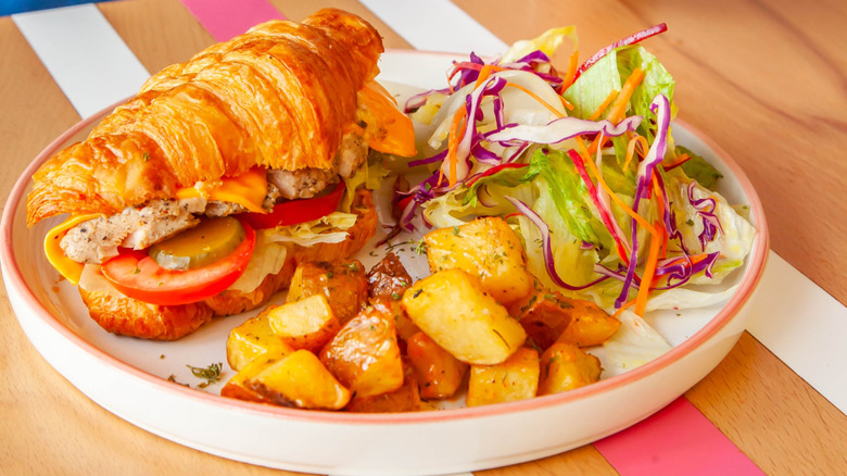 a dunkin' breakfast croissant sandwich