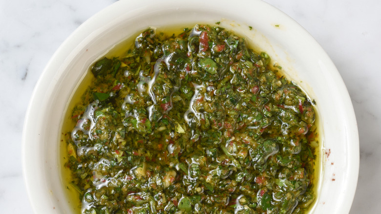 White bowl filled with chimichurri