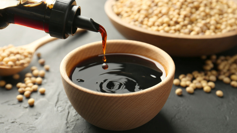 Tamari sauce in a bowl with soybeans