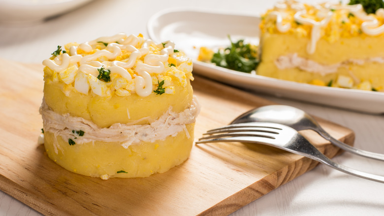 Causa de atún on cutting board