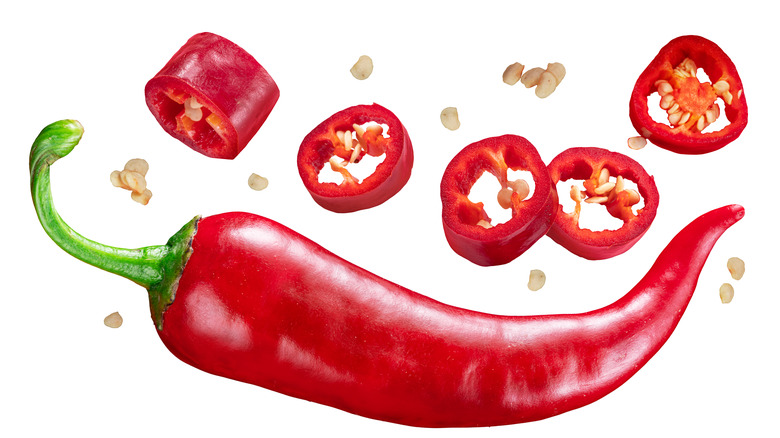 Red chili pepper with slices and seeds