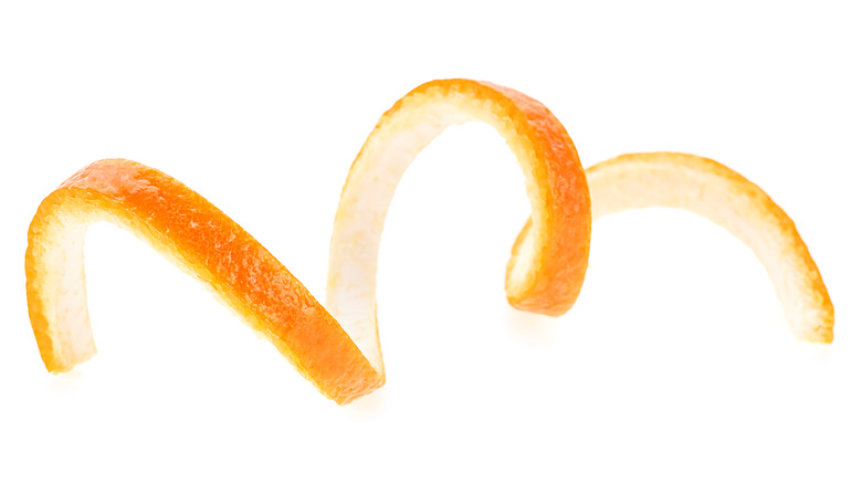 Spiral orange peel on white background