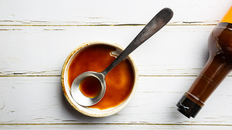 Worcestershire sauce in bowl with spoon