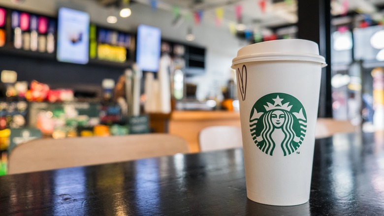 White Starbucks cup on black table