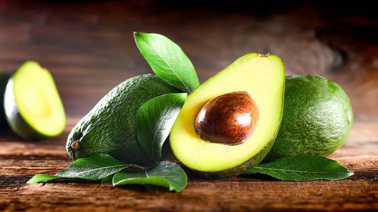 Fresh avocados on table