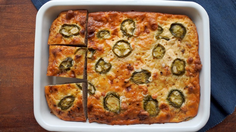 Jalapeño cornbread in white baking dish