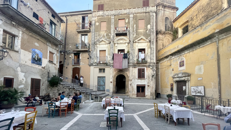 Italian plaza with empty tables