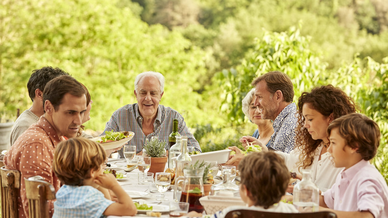 family eating meal together outside