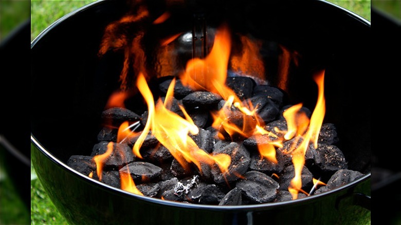 Lit charcoal grill