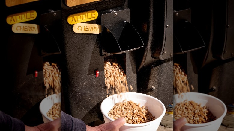 Wood pellets pouring from smoker