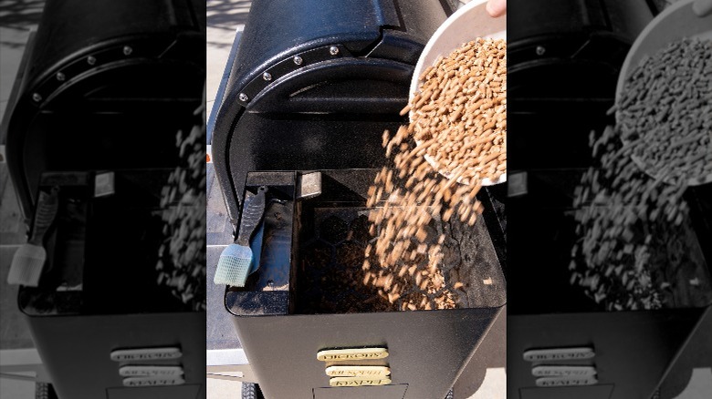 Pouring wood pellets in hopper