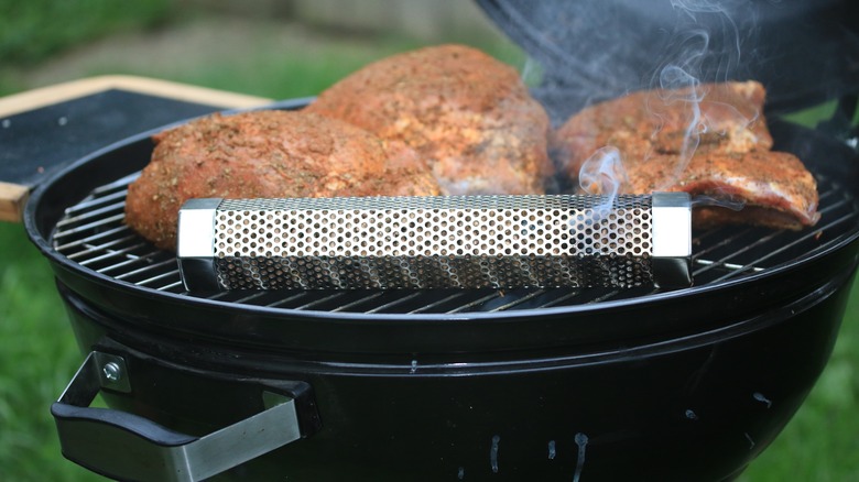 Grill with wood pellet tube