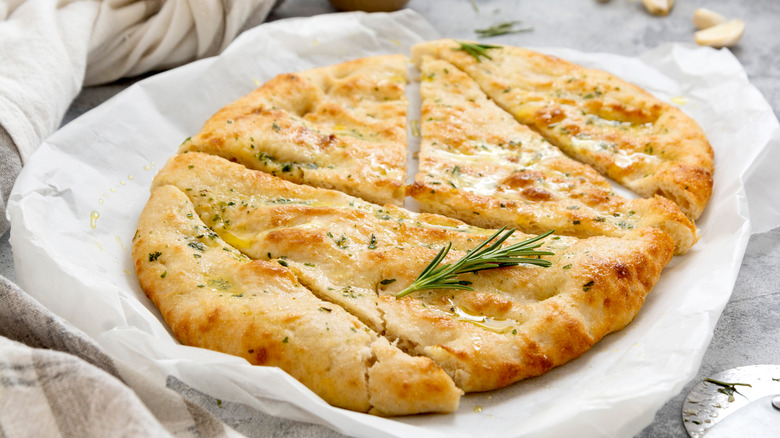 Baked pizza crust with herbs