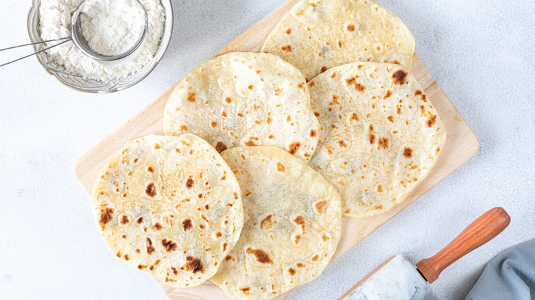 Tortillas on wooden board