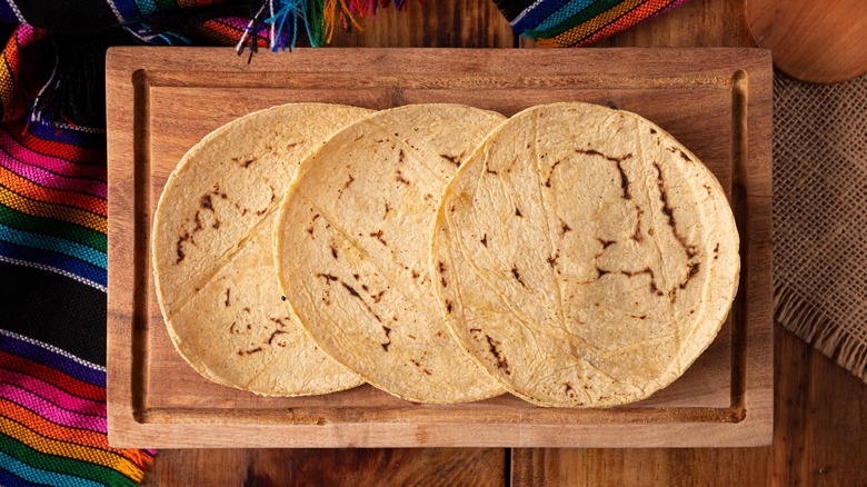 tortillas on wooden board 