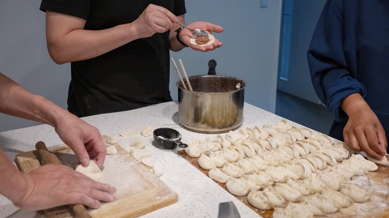 Family making dumplings