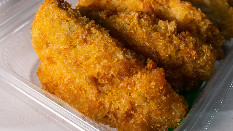 Chicken tenders in plastic container