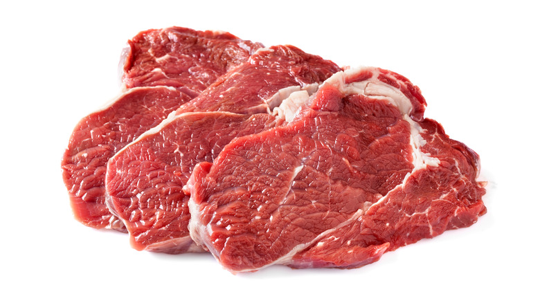 Chuck steaks on white background