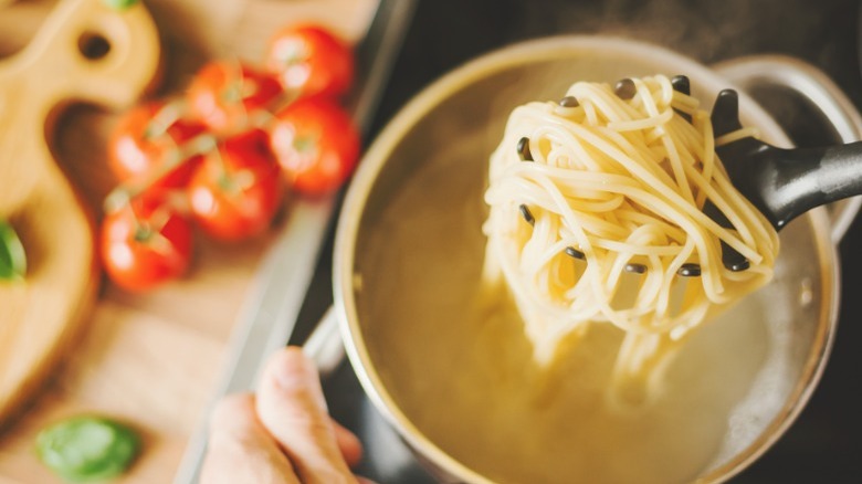 Pulling pasta out of water