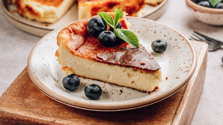 Basque cheesecake slice with blueberries