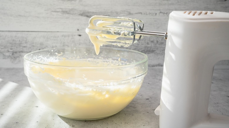 Mixing cheesecake batter in bowl