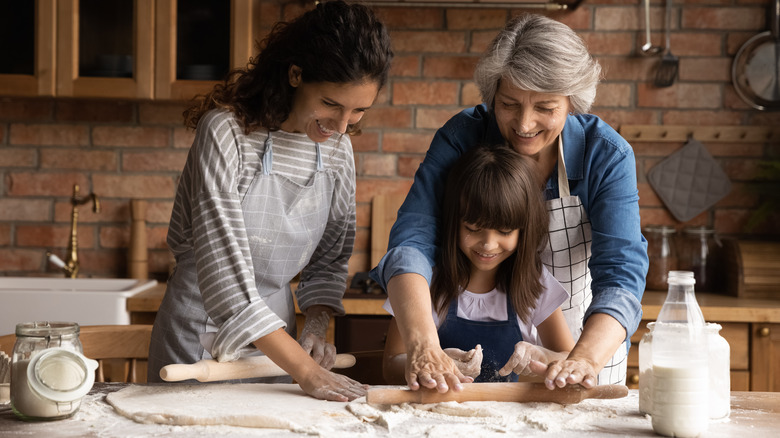 family rolling dough