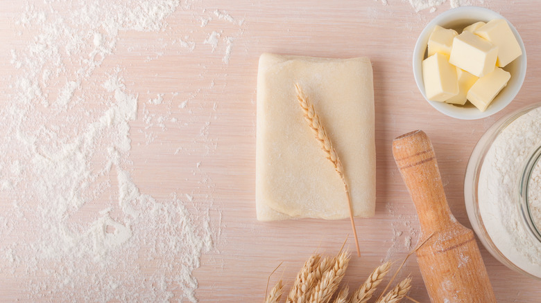 Folded dough on floured counter