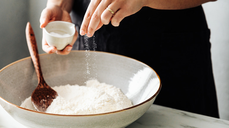 adding salt to flour