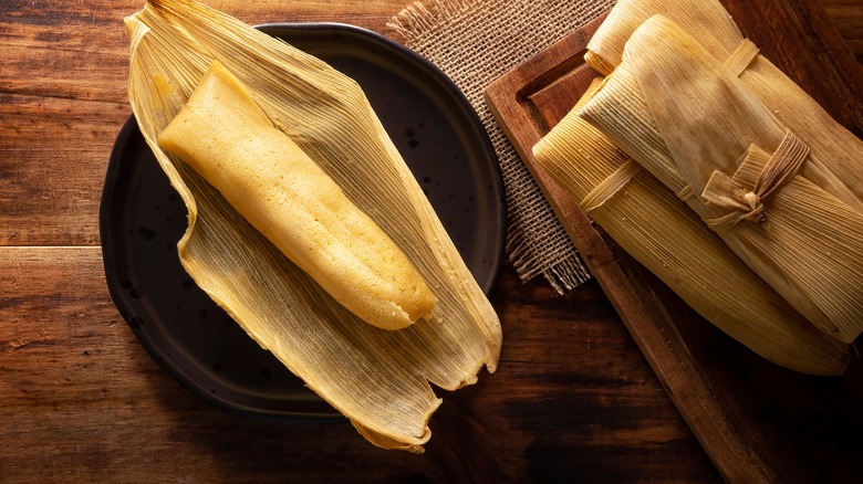 Cooked tamale in husk