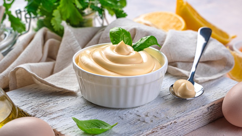 bowl of mayonnaise with fresh herbs