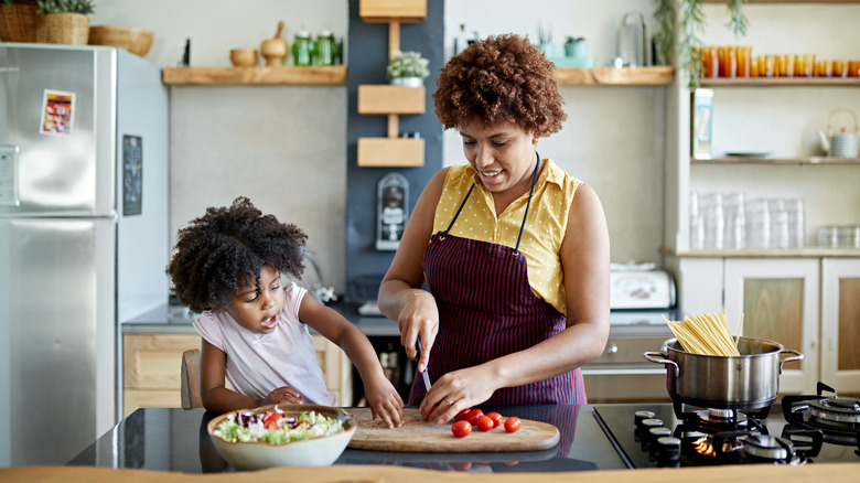 Woman and child cooking