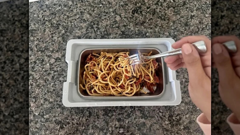 Heated lunch box with spaghetti