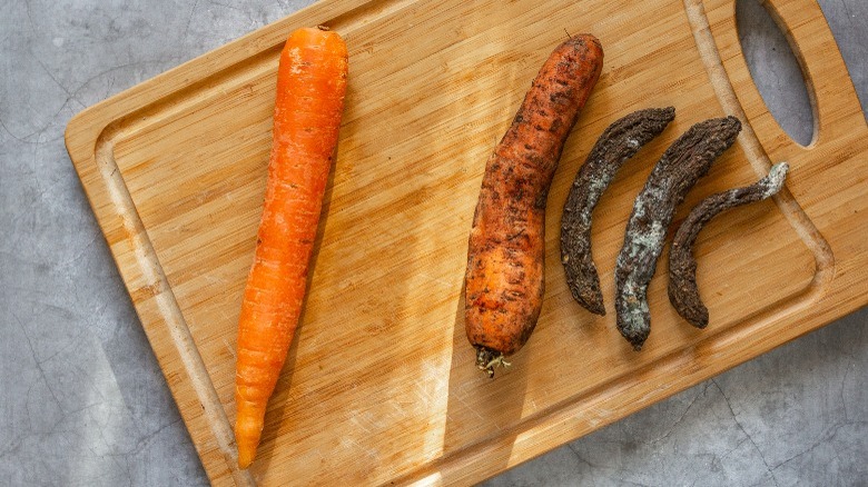 fresh and rotten carrots board
