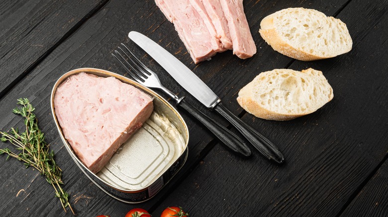 Canned ham sliced on table