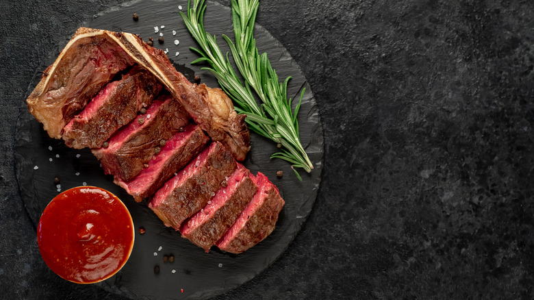 steak with thyme on platter