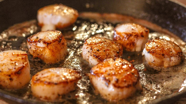 Scallops searing in brown butter