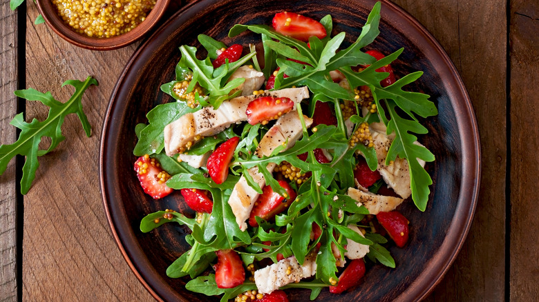 Strawberries and chicken in salad